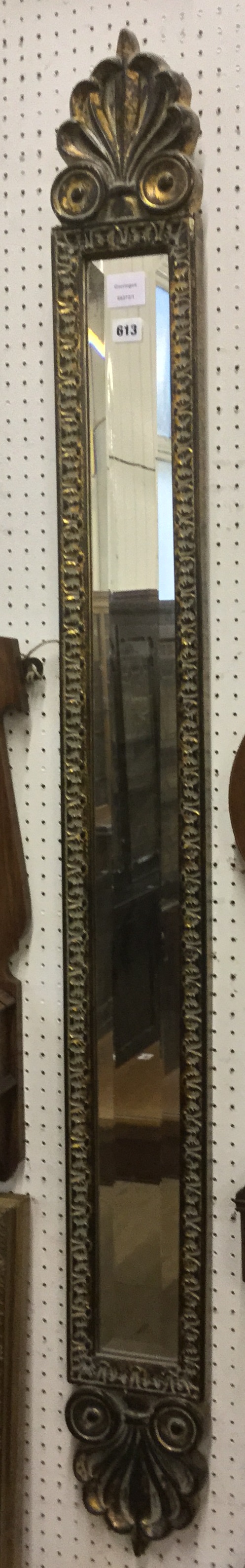 Long narrow carved framed mirror